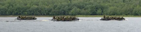 Members of 42 HCS and the Infantry travel across George Lake to conduct raids