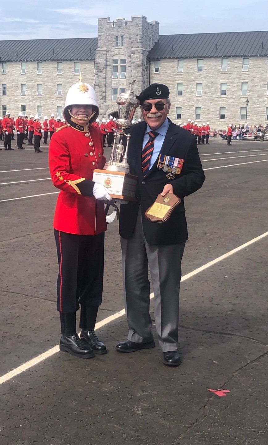 Col John Lesperance (Ret'd) presents the Maj Gen JA Stewart Trophy to 29710 OCDT Megan Roy.