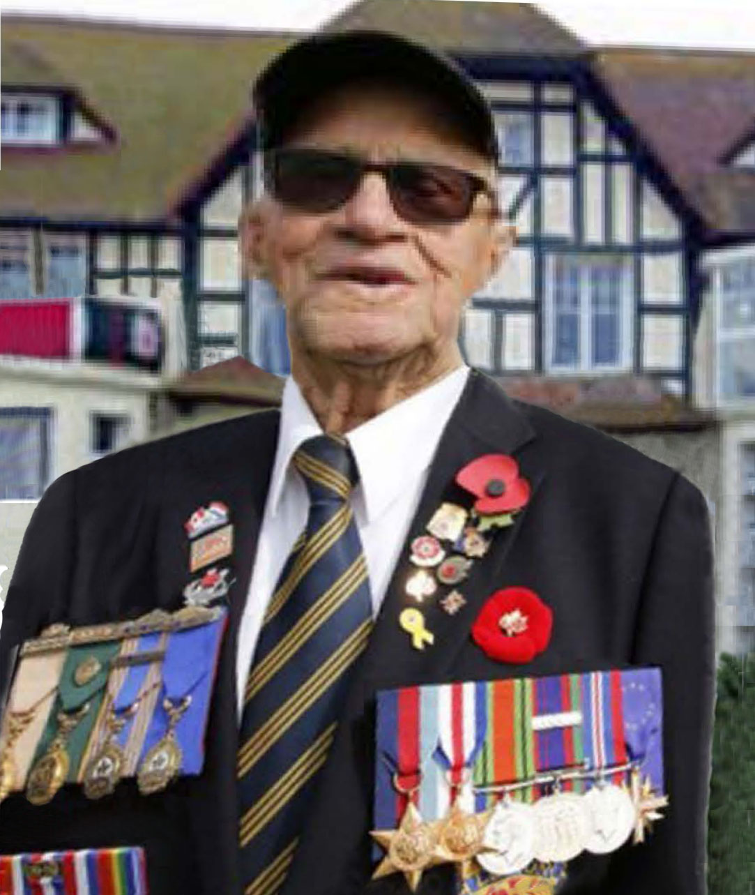 Dan Galipeau in front of Queen's Own Rifles of Canada House in Bernière-sur-Mer