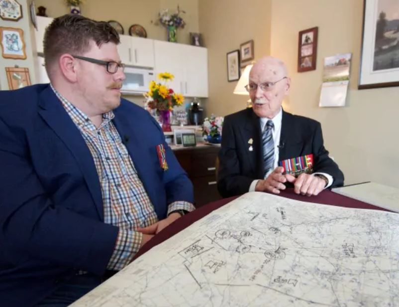 George Fouchard, right, goes over a campaign map with Nathan Kehler at Fouchard's apartment in Ottawa April 23, 2019. (Andrew LeeCBC News)