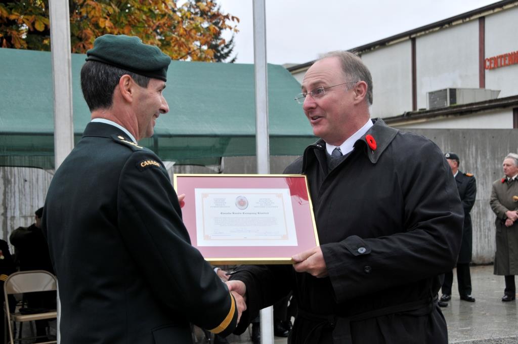 MGen Benjamin presents Certificate to Canada Lands corporation in Chilliwack