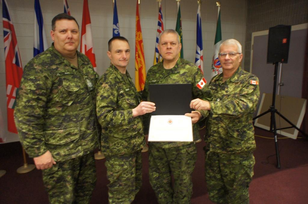 CWO R.G. Swift (CME Branch CWO), MGen J.S. Sirois (CAF Chief Military Engr), Sgt J.J.C. Maillet and the CME Branch Col Cmdt, BGen S.M. Irwin (Ret’d). Presentation date: 16 Feb 2017