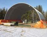 The barrel shaped roof of the practice C-Span, 50’x50’, is completed and shown after the pouring of the concrete pony walls which need to be heated and protected from the cold.