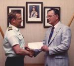 Marvin Johnston presents LCol Ken Holmes, Comdt CFSME with a cheque for the CFSME  Heritage Fund from the Retired Sappers