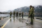 Army Reserve Combat Engineers assemble a Medium Floating Bridge on Cultus Lake near Chilliwack, B.C., during Exercise PALADIN RESPONSE 2013. This exercise allows participating soldiers to practice water and gap crossing tasks. These skills enable the Canadian Army to provide mobility support to provincial and local authorities, if required, in response to natural disasters. Photo credit: Bombardier Albert Law, Canadian Armed Forces