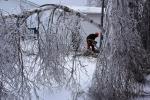 Member of 4 Engineer Support Regiment felling an ice laden tree