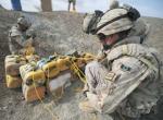 Canadian combat engineers rig improvised explosive devices with C-4 and a detonation cord to dispose of them.