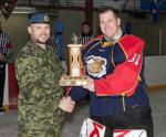 WCEO Maj Comeau presents Cpl Easton 1 CER Edm Top Goalie of Tournament Trophy // Maj Comeau, O GC Ere, présente au Cpl Easton de l’équipe