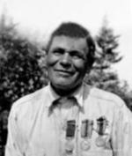 Mr. Glode with his medals (Distinguished Conduct Medal, British War Medal, Victory Medal) taken by Clara Dennis