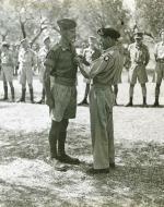 Lt Ken Heron receives the Military Cross from MC from General Bernard Montgomery at the end of the Sicilian Campaign.