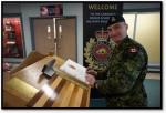 ADM(IE)’s Chief of Staff, MGen Sylvain Sirois, signs the guest book while attending Exercise UBIQUE at the Canadian Forces School of Military Engineering at CFB Gagetown.