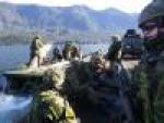 The raft crew from 39 Combat Engineer Regiment and members of The British Columbia Dragoons recce squadron ferry across Cultus Lake, BC during raft training on Exercise Worthy Sapper.