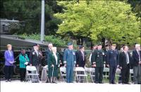 Assembled guests witness unveiling of a plaque commemorating Col Mitchell, VC, MC Assembled guests witness unveiling of a plaque commemorating Col Mitchell, VC, MC