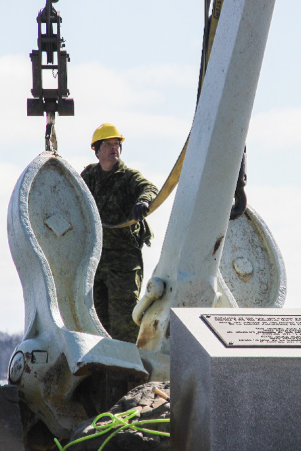 Members of 144 and 143 Construction Engineering Flight, based out of Pictou and Bridgewater, conducted the repair work on the Bonaventure Memorial, and used a crane on March 19 to connect the anchor to the newly built metal mounts.  Photo: Ryan Melanson, Trident