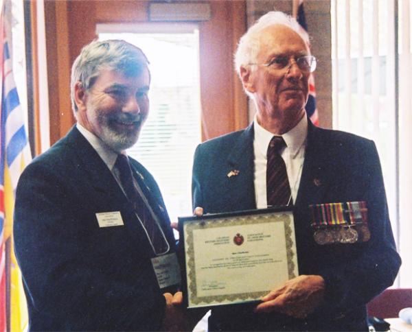 Ken Chisholm receiving the CMEA Commendation from CMEA President John MacPherson