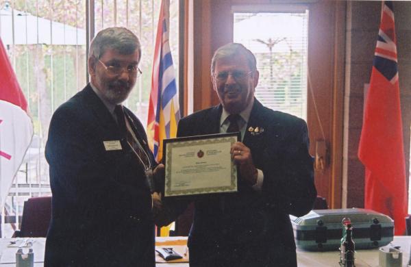 Brian Cleaver receiving the CMEA Commendation from CMEA President John MacPherson