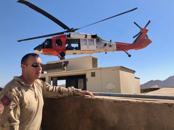 October 2018 – Corporal Colton Larade explains how all supplies used by troops working at Multinational Force and Observers (MFO) Remote Site are brought to the island by MFO Blackhawk helicopters. (Photo Credit: Captain Nicola LaMarre, Operation CALUMET Public Affairs Officer)