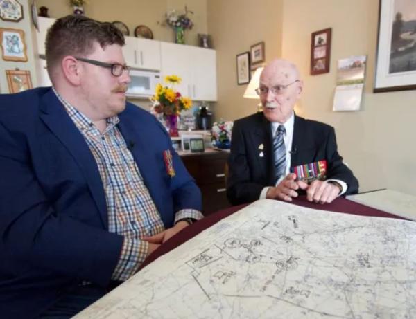 George Fouchard, right, goes over a campaign map with Nathan Kehler at Fouchard's apartment in Ottawa April 23, 2019. (Andrew LeeCBC News)