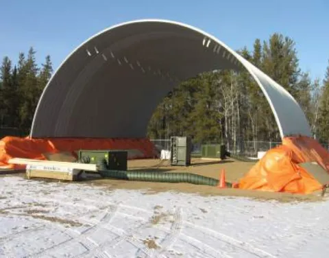The barrel shaped roof of the practice C-Span, 50’x50’, is completed and shown after the pouring of the concrete pony walls which need to be heated and protected from the cold.