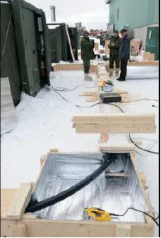 MWO Beaumier, Capt Boucher and site owner François Giguère inspect the facilities.