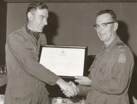 BGen St. Aubin presents Scroll to Marvin Johnston on promotion to CWO 1976