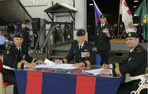 LCol N Pilon hands over command of 2 CER to LCol M Gasparotto under the supervision of Col Dawe, Comd 2 CMBG // Le Lcol N Pilon transfère le commandement du 2 RGC au Lcol M Gasparotto sous la supervision du Col Dawe, cmdt 2 GBMC.