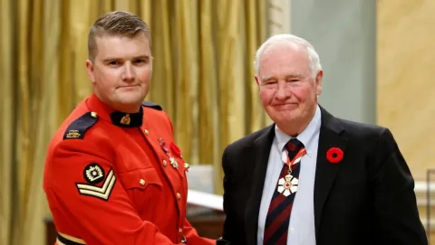 RCMP Constable Curtis Barrett, of Chelsea, Que., receives the Star of Courage from Governor General David Johnston during the Bravery Awards at Rideau Hall, in Ottawa on Friday, October 28 2016. (Fred Chartrand / THE CANADIAN PRESS)
