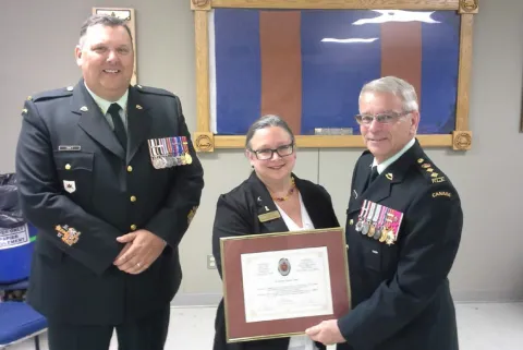 CWO R.G. Swift (CME Branch CWO // Adjuc de la Branche du GMC), Ms // Mlle Sandra Johnson-Penney (Curator CME Museum // conservatrice du Musée du GMC) and the Col Comdt, BGen S.M. Irwin (Ret’d). 