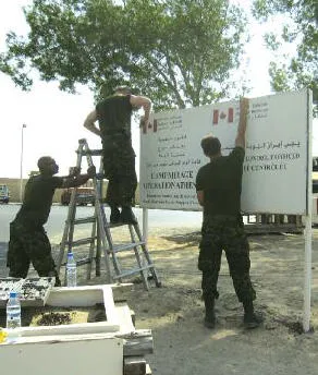 Removing Camp MIRAGE sign