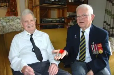 Mr. Russell Power presents French Legion of Honour to RCE veteran Mr. Bill Nicoll.