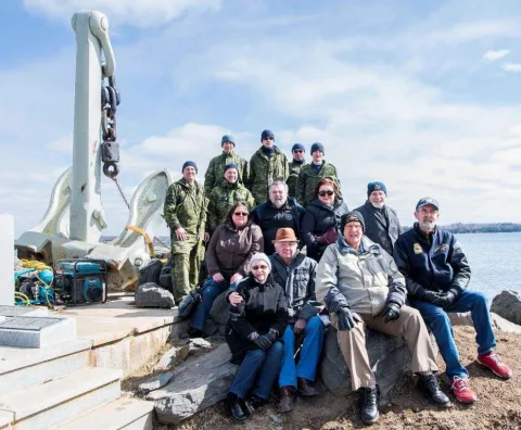 Front row from left, Elspie and Charles Caterer, Brian Lapierre, Jim Mosley. Middle row from left, Patti Christie, Dinger Bell, Valerie Griffin and Dick Tilley. Back row from left, CAF members from 144 and 143 CEF – Corporal (Cpl) Rob White, Captain Marc Lukaszczyk-Therien, Sgt Joe Wynands, Avr Travis Decker, Cpl Clarence Parnell, and Avr Joshua McKay. Photo: Mona Ghiz, MARLANT PA