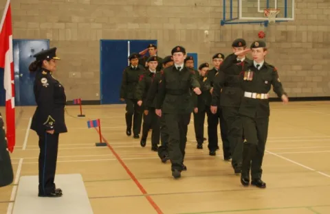 The cadets march past Reviewing Officer St'atl'imx Tribal Police Chief Officer Deborah Doss-Cody. 
