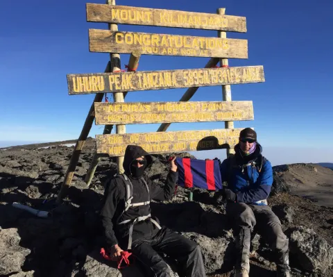 Major Mark Phillips and Ed Batchelor, Major (Ret’d) proudly holding the CME Flag at the summit of Mount Kilimanjaro - 21 July 2017