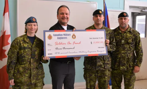 Cpl Jennifer Fraser, Maj Alexandre Landry, OC RP Ops Det Kingston, Maj (Ret'd) Chris Catry, and receiving the cheque on behalf of Soldier On / Sans Limites, MWO Ed Butt, Sgt-Maj RP Ops Det Kingston.