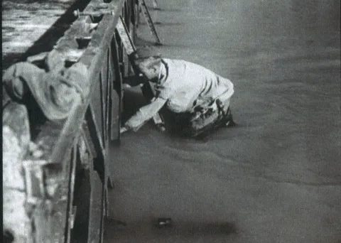 Spr LW Robinson working on a Bailey Bridge over the Metauro River Bailey 26 Aug 44