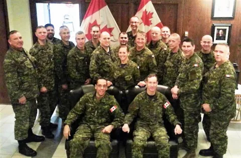 Colonel Martin Gros-Jean, Comd CF RP Ops Gp (seated, left) and Chief Warrant Officer Gord Aitken, FCWO (seated, right) surrounded by the Regional command teams and CF HQ staff.