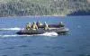 An assault boat from 39 Combat Engineer Regiment parallels the vehicle raft during a crossing of Cultus Lake during Exercise Worthy Sapper on 21 Feb 2015. 