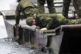 Reserve combat engineers were given hands-on training in bridge building during Exercise PALADIN RESPONSE. The medium raft or medium floating bridge is assembled on water and once the pieces are secure, it can be used to ferry large military vehicles from the water to land. - Photo: Sgt Greg Gorecki/41 CER